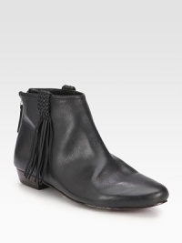 Braided fringe adds casual-cool style to this supple leather design with an easy back zipper. Leather upperBack zipLeather lining and solePadded insoleImported Braided fringe adds casual-cool style to this supple leather design with an easy back zipper. Leather upperBack zipLeather lining and solePadded insoleImported