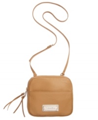 Buttery soft leather and charming silver-tone hardware lend a polished look to this irresistible silhouette from Calvin Klein. Dual main zip compartments keep valuables safe while adjustable crossbody strap gives you the freedom to hail a taxi while holding your morning cup of coffee.