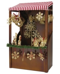 Find something unique in the Byers' Choice Straw Market. A stall filled with traditional German ornaments and topped with a striped awning beckons hordes of holiday shoppers. Green garland adds to its quaint appeal. Find something unique in the Byers' Choice Straw Market. A stall filled with traditional German ornaments and topped with a striped awning beckons hordes of holiday shoppers. Green garland adds to its quaint appeal.