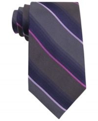 In a traditional stripe pattern, this Calvin Klein tie recalls classic haberdashery style. In a traditional stripe pattern, this Calvin Klein tie recalls classic haberdashery style.