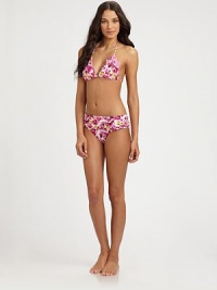 A classic style complemented by a pretty floral print.Triangle cupsHalter strap ties at neckBack tie closure87% nylon/13% spandexFully linedHand washImported Please note: Bikini bottom sold separately. A classic style complemented by a pretty floral print.Triangle cupsHalter strap ties at neckBack tie closure87% nylon/13% spandexFully linedHand washImported Please note: Bikini bottom sold separately.