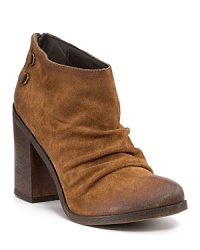 Soft, scrunched suede slouches atop a chunky heel for a chic, easygoing take on the classic cowboy boot. By Boutique 9. Soft, scrunched suede slouches atop a chunky heel for a chic, easygoing take on the classic cowboy boot. By Boutique 9.