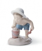 Recall blissful summers spent building sandcastles and catching crabs with this glazed Lladro figurine capturing all the joy of kids at the beach.