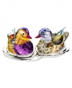 A striking pair, the Topaz Mandarin duck figurines nest together in a bed of silvertone metal. Exquisite faceted detail and vibrant colors in Swarovski crystal capture the natural beautiful of the real birds.