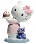 Make a wish! The Hello Kitty Happy Birthday figurine will be the icing on her cake, featuring the famous Sanrio cat in glazed porcelain from Nao by Lladro.