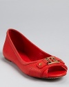 A peep toe flat from Tory Burch--crafted in luxe pebbled leather with shining gold-tone hardware.