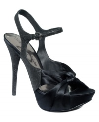 Knots can be so beautiful. With its satin and glitter upper and knotted toe strap, GUESS by Marciano's Carmo2 platform evening sandals will show you why. Knots can be so beautiful. With its satin and glitter upper and knotted toe strap, GUESS by Marciano's Carmo2 platform evening sandals will show you why.