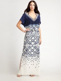 A gorgeous neckline, fluid fabric and a sophisticated length make this caftan an incredibly chic coverup.V-neckDolman sleevesSelf beltSide slitSilkDry cleanMade in USA of imported fabric A gorgeous neckline, fluid fabric and a sophisticated length make this caftan an incredibly chic coverup.V-neckDolman sleevesSelf beltSide slitSilkDry cleanMade in USA of imported fabric