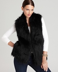 Lend a touch of opulence to your everyday style with a plush faux-fur DKNY vest, finished with a contrast knit back for a flawless fit. Lend a touch of opulence to your everyday style with a plush faux-fur DKNY vest, finished with a contrast knit back for a flawless fit.