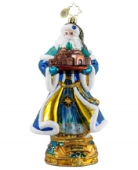 In sparkling blue and gold hues, cheery Santa Claus holds a small replica of the city of Bethlehem in this hand-painted ornament from Christopher Radko. In sparkling blue and gold hues, cheery Santa Claus holds a small replica of the city of Bethlehem in this hand-painted ornament from Christopher Radko.