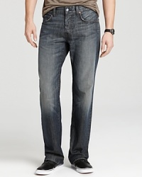 A comfy, everyday relaxed fit jean in a dark wash with distressed edges, light fading and contrast embroidery at pocket. A comfy, everyday relaxed fit jean in a dark wash with distressed edges, light fading and contrast embroidery at pocket.
