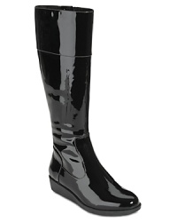 Rain-slick patent leather makes Cole Haan's weather boots a shining example of gloomy day style. Rain-slick patent leather makes Cole Haan's weather boots a shining example of gloomy day style.