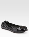 A modern classic in shiny patent leather with logo detail, tonal stitching and a comfortable elasticized back. Front patent leather logo Elasticized back Leather lining Padded insole Rubber sole ImportedOUR FIT MODEL RECOMMENDS ordering true size.. 