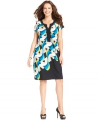 Make a splash with Alfani's short sleeve plus size dress, highlighted by a wavy print. Make a splash with Alfani's short sleeve plus size dress, highlighted by a wavy print.