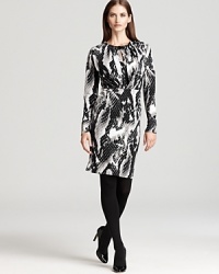 Infuse your 9-to-5 style with serious modern edge as a bold abstract print and bejeweled neckline update the essential Jones New York Collection dress. Infuse your 9-to-5 style with serious modern edge as a bold abstract print and bejeweled neckline update the essential Jones New York Collection dress.