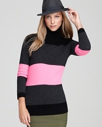 City chic meets classic prep as exaggerated stripes embolden a C by Bloomingdale's cashmere turtleneck--stunning when teamed with colored denim. City chic meets classic prep as exaggerated stripes embolden a C by Bloomingdale's cashmere turtleneck--stunning when teamed with colored denim.