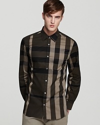 In a flattering palette of darker earth tones, the Treyforth sport shirt showcases Burberry's signature check print. In a flattering palette of darker earth tones, the Treyforth sport shirt showcases Burberry's signature check print.