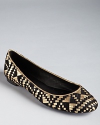 Golden leather is intertwined amongst soft suede on Rebecca Minkoff's Uma ballet flats. Golden leather is intertwined amongst soft suede on Rebecca Minkoff's Uma ballet flats.