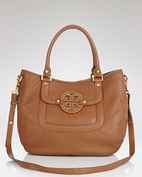 Tory Burch's hobo enlivens classic leather her signature stamp and a must-have hue. From workday to weekend, this versatile bag will make closet staples pop. Tory Burch's hobo enlivens classic leather her signature stamp and a must-have hue. From workday to weekend, this versatile bag will make closet staples pop.