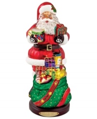 Up to his beard in gifts, the Toy Santa figurine is the essence of holiday cheer. Handcrafted glass is brilliantly painted with glittering detail in classic Christopher Radko style. Up to his beard in gifts, the Toy Santa figurine is the essence of holiday cheer. Handcrafted glass is brilliantly painted with glittering detail in classic Christopher Radko style.