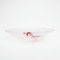 Each unique, this artistic bowl, designed by Anna Ehrner features swirling lines and veils of color.