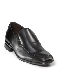 Leather slip on shoes with elastic inserts on side with rounded, square toe. Stitching detail along toe. Rubber sole, slight heel. Leather slip on shoes with elastic inserts on side with rounded, square toe. Stitching detail along toe. Rubber sole, slight heel.