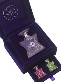 Stashed securely in the top drawer of a bi-level jewel box is a 1.7 oz. Swarovski gem-encrusted bottle of the Scent of Peace, its dove and curlicue design delicately traced with Swarovski stones. Down below are two miniature flacons both containing the Scent of Peace, covered all over in purple velvet and amethyst Swarovski gems. Made in USA. 