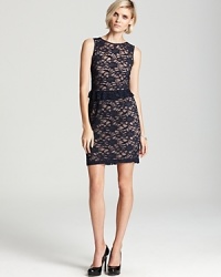 A subtle peplum feels delicately feminine on this sleeveless Aidan Mattox dress, rendered in dark-hued lace. A subtle peplum feels delicately feminine on this sleeveless Aidan Mattox dress, rendered in dark-hued lace.