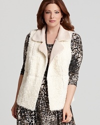 Reverse seaming lends intrigue to this Karen Kane faux fur vest--a glamorous accent to your seasonal wardrobe. Reverse seaming lends intrigue to this Karen Kane faux fur vest--a glamorous accent to your seasonal wardrobe.