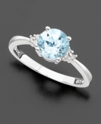 A large, round-cut aquamarine (1-1/10 ct. t.w.) with a trio of diamond accents shimmering at each side. Set in 14k white gold. A large, round-cut aquamarine (1-1/10 ct. t.w.) with a trio of diamond accents shimmering at each side. Set in 14k white gold.