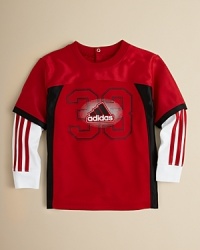 A sporty look for your little, featuring Adidas' iconic styling on a football jersey, updated with knit insets for the layered look without the bulk. A sporty look for your little, featuring Adidas' iconic styling on a football jersey, updated with knit insets for the layered look without the bulk.