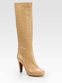 Step out in this notice-me silhouette of creamy leather, propped with a platform and tall heel. Self-covered heel, 3¾ (95mm)Hidden platform, ½ (15mm)Compares to a 3¼ heel (80mm)Shaft, 16¼Leg circumference, 14Leather upperPull-on styleLeather lining and solePadded insoleImportedOUR FIT MODEL RECOMMENDS ordering one half size up as this style runs small. Step out in this notice-me silhouette of creamy leather, propped with a platform and tall heel. Self-covered heel, 3¾ (95mm)Hidden platform, ½ (15mm)Compares to a 3¼ heel (80mm)Shaft, 16¼Leg circumference, 14Leather upperPull-on styleLeather lining and solePadded insoleImportedOUR FIT MODEL RECOMMENDS ordering one half size up as this style runs small.