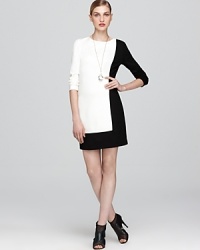 Spliced in graphic black and white, this Trina Turk color-block dress boasts sophisticated tailoring with a cutting-edge sensibility. Spliced in graphic black and white, this Trina Turk color-block dress boasts sophisticated tailoring with a cutting-edge sensibility.