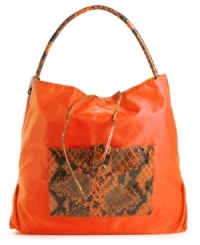 A casual nylon silhouette accented with a bold snakeskin print. This go-anywhere hobo will add a fiercely fun feel to any outfit. Bonus: this style is reversible! A casual nylon silhouette accented with a bold snakeskin print. This go-anywhere hobo will add a fiercely fun feel to any outfit. Bonus: this style is reversible!