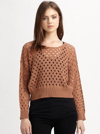 Downtown-cool sweater in a cropped, open-knit silhouette with ribbed trim and lots of swagger. RoundneckDropped shouldersLong dolman sleevesRibbed cuffs and hemAbout 20 from shoulder to hemAcrylicHand washImportedModel shown is 5'11 (178cm) wearing US size Small.