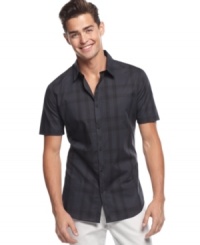 A fail-safe bet for your summer look is this dark plaid short-sleeved shirt from Calvin Klein. A fail-safe bet for your summer look is this dark plaid short-sleeved shirt from Calvin Klein.