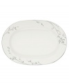 Birch branches grow around this pure white porcelain oval platter, turning formal tables into serene landscapes. A contemporary design refined in polished platinum with a breezy, all-natural beauty. From Noritake's collection of serveware and serving dishes.