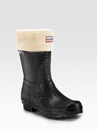 A rainy-day essential in chic, snake-embossed rubber, this short style offers plenty of protection. Heel, ¾ (20mm) Shaft, 10 Leg circumference, 15 Buckle detail on upper Padded insole Rubber sole Imported OUR FIT MODEL RECOMMENDS ordering true whole size; ½ sizes should order the next whole size up.NOTE: During the manufacturing of the natural rubber compound used to make Hunter boots, a white wax is inserted into the mix to help protect the rubber. A rainy-day essential in chic, snake-embossed rubber, this short style offers plenty of protection. Heel, ¾ (20mm) Shaft, 10 Leg circumference, 15 Buckle detail on upper Padded insole Rubber sole Imported OUR FIT MODEL RECOMMENDS ordering true whole size; ½ sizes should order the next whole size up.NOTE: During the manufacturing of the natural rubber compound used to make Hunter boots, a white wax is inserted into the mix to help protect the rubber.