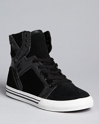 Cool crocodile embossing accents this updated basketball sneaker from Supra. Cool crocodile embossing accents this updated basketball sneaker from Supra.