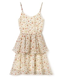 Rich ruffles in floral peplum, Un Deux Trois's tiered dress recalls a classic look that looks fresh anytime. Rich ruffles in floral peplum, Un Deux Trois's tiered dress recalls a classic look that looks fresh anytime.