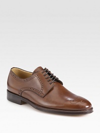 Washed calfskin leather lace-up derby style with signature brogue detail makes a handsome addition to any dress wardrobe.Leather upperLeather liningPadded insoleLeather soleImported Washed calfskin leather lace-up derby style with signature brogue detail makes a handsome addition to any dress wardrobe.Leather upperLeather liningPadded insoleLeather soleImported