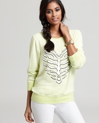 A heart-shaped skeleton makes a quirky statement on this electrically hued WILDFOX sweatshirt. A heart-shaped skeleton makes a quirky statement on this electrically hued WILDFOX sweatshirt.