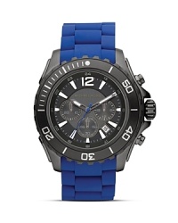 Make a statement with this bold watch from Michael Kors, boasting a gunmetal dial. Sporty yet sleek, this piece ensures you're always ready for action. Make a statement with this bold watch from Michael Kors, boasting a gunmetal dial. Sporty yet sleek, this piece ensures you're always ready for action.