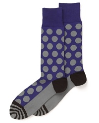 Polka dots are offset with stripes on the toe and a color-blocked calf, heel and foot for a dynamic design that grounds your look in wit. Polka dots are offset with stripes on the toe and a color-blocked calf, heel and foot for a dynamic design that grounds your look in wit.