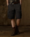 Crafted from faded and frayed cotton chino twill, a classic cargo short looks right at home in the urban jungle with its rugged safari style and utility details.