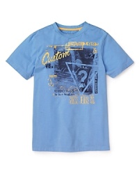Distressed GUESS logo print adorns this sporty crewneck tee. Distressed GUESS logo print adorns this sporty crewneck tee.