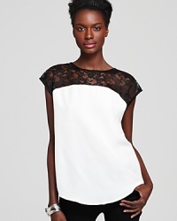 Lace lends a feminine finish to this mod two-tone Aqua top--a simple yet statement-making addition to your wardrobe. Lace lends a feminine finish to this mod two-tone Aqua top--a simple yet statement-making addition to your wardrobe.