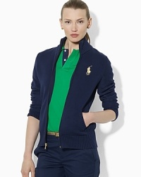 An elegant full-zip sweater is knit in soft cotton for a lighter weight, and finished with glistening metallic details. An elegant full-zip sweater is knit in soft cotton for a lighter weight, and finished with glistening metallic details.