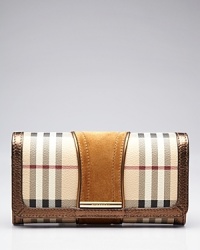 An always essential, this compact Burberry bi-fold wallet secures with a snap and opens to a surprisingly spacious interior with 14 credit card pockets and one zip pocket. An always essential, this compact Burberry bi-fold wallet secures with a snap and opens to a surprisingly spacious interior with 14 credit card pockets and one zip pocket.