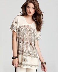 An artful illustration and colorful rhinestone embellishments enhance this Free People tunic--unearth your inner Mediterranean goddess. An artful illustration and colorful rhinestone embellishments enhance this Free People tunic--unearth your inner Mediterranean goddess.